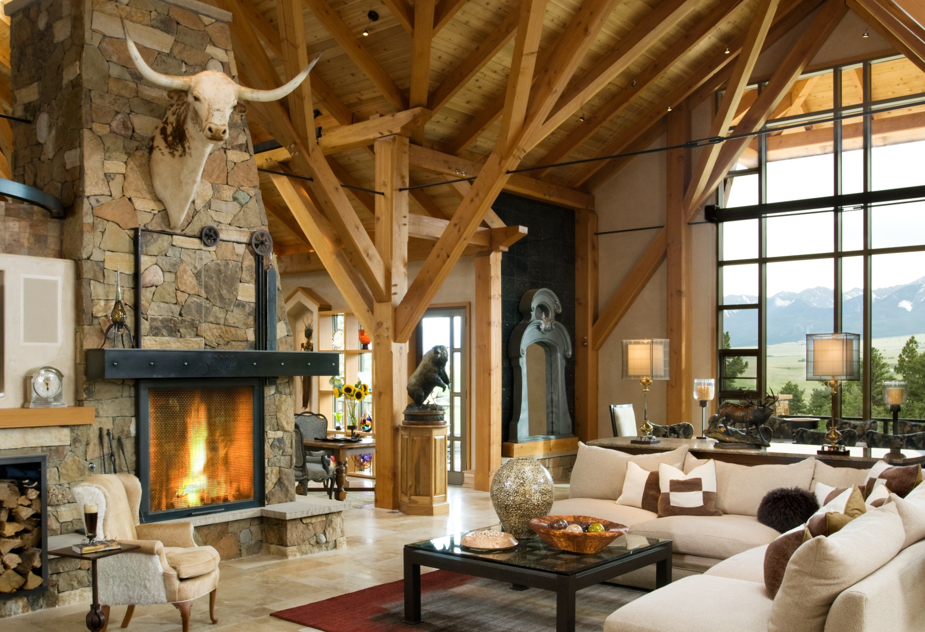 Timber home great room fireplace and timbers