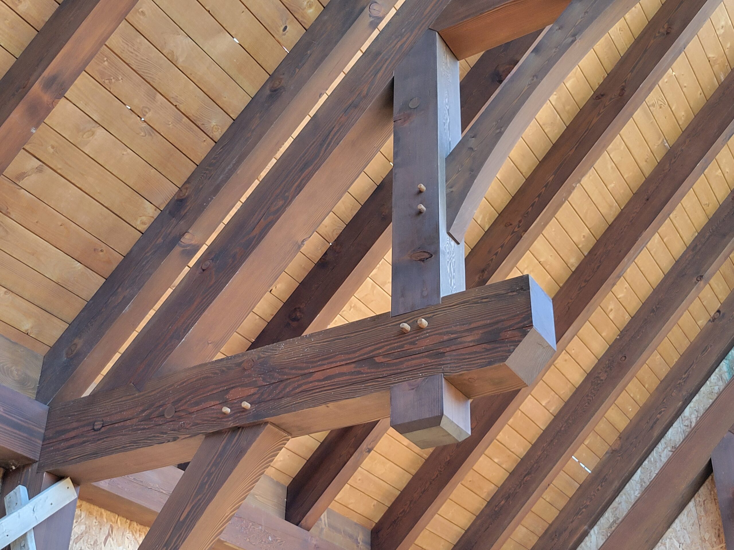 Shipping timber frame homes: labeled BC timbers loaded on a truck bound for a US site