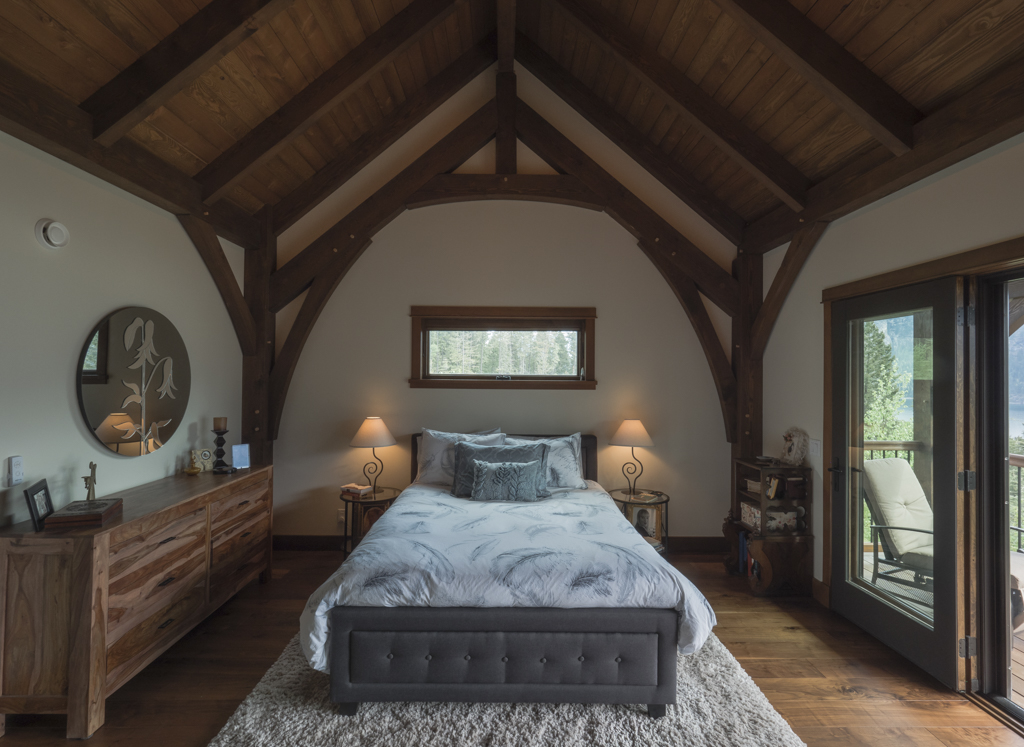 Timber frame living room with warm lighting and natural wood accents.