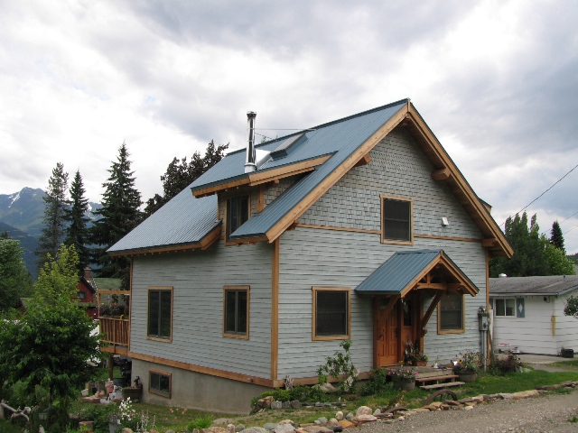 prefab timber frame home surrounded by natural landscape.